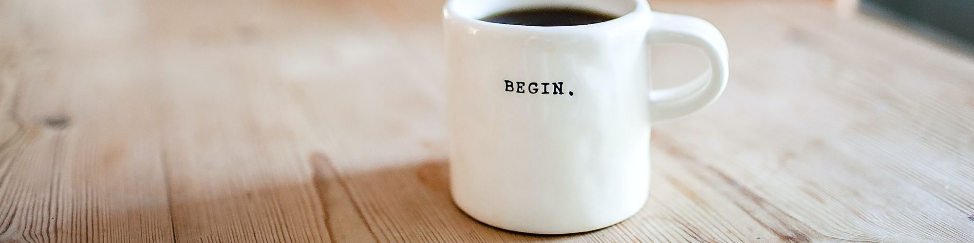 Coffee Mug with the word Begin